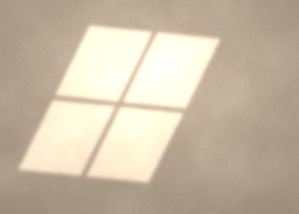 Afternoon light from a window on a plaster wall